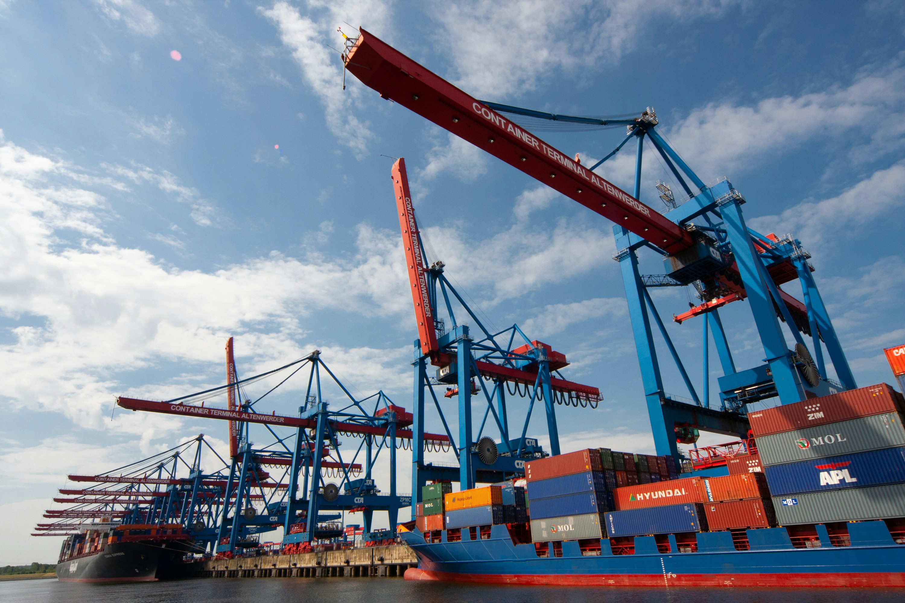 Port cranes and container vessels during cargo operations
